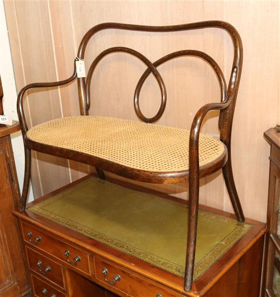 A late Victorian childs bentwood caned seated settee W.85cm